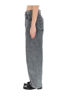 Back view of baum und pferdgarten women’s grey wide-leg denim jeans with an embroidered b on the back pocket