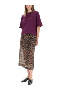 Purple oversized t-shirt with subtle embroidered chest logo paired with baum und pferdgarten women’s shevin beige skirt