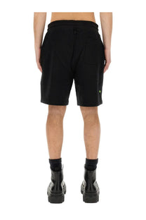 Belstaff men’s black cotton shorts with a drawstring waistband and a small green logo on the lower right leg