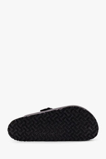 Black rubber sole with distinctive wavy tread on birkenstock men’s boston leather sandals black back side view