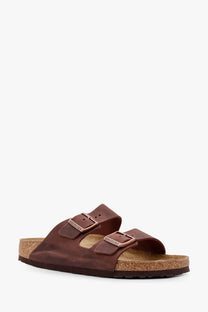 Brown leather birkenstock arizona unisex sandals with two adjustable straps and cork footbed