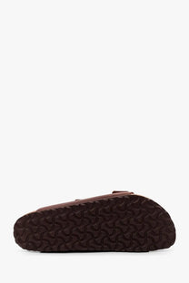 Birkenstock unisex arizona brown leather sandal with textured rubber sole shown from the back side