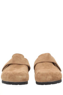 Birkenstock unisex mule loma brown tan suede clogs with black rubber sole shown from the back side