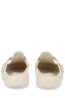 Beige birkenstock unisex sabot boston rubber clog sandals with soft cushioned sole and adjustable strap closure