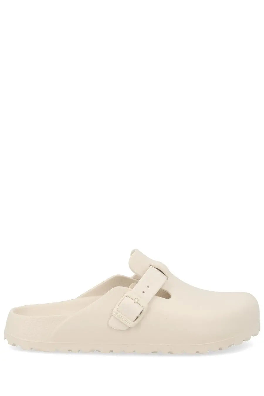 Cream-colored Birkenstock unisex Sabot Boston clog with single strap and buckle made of durable material