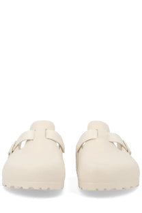 Cream-colored birkenstock unisex sabot boston white clogs with smooth suede-like upper and classic mule design