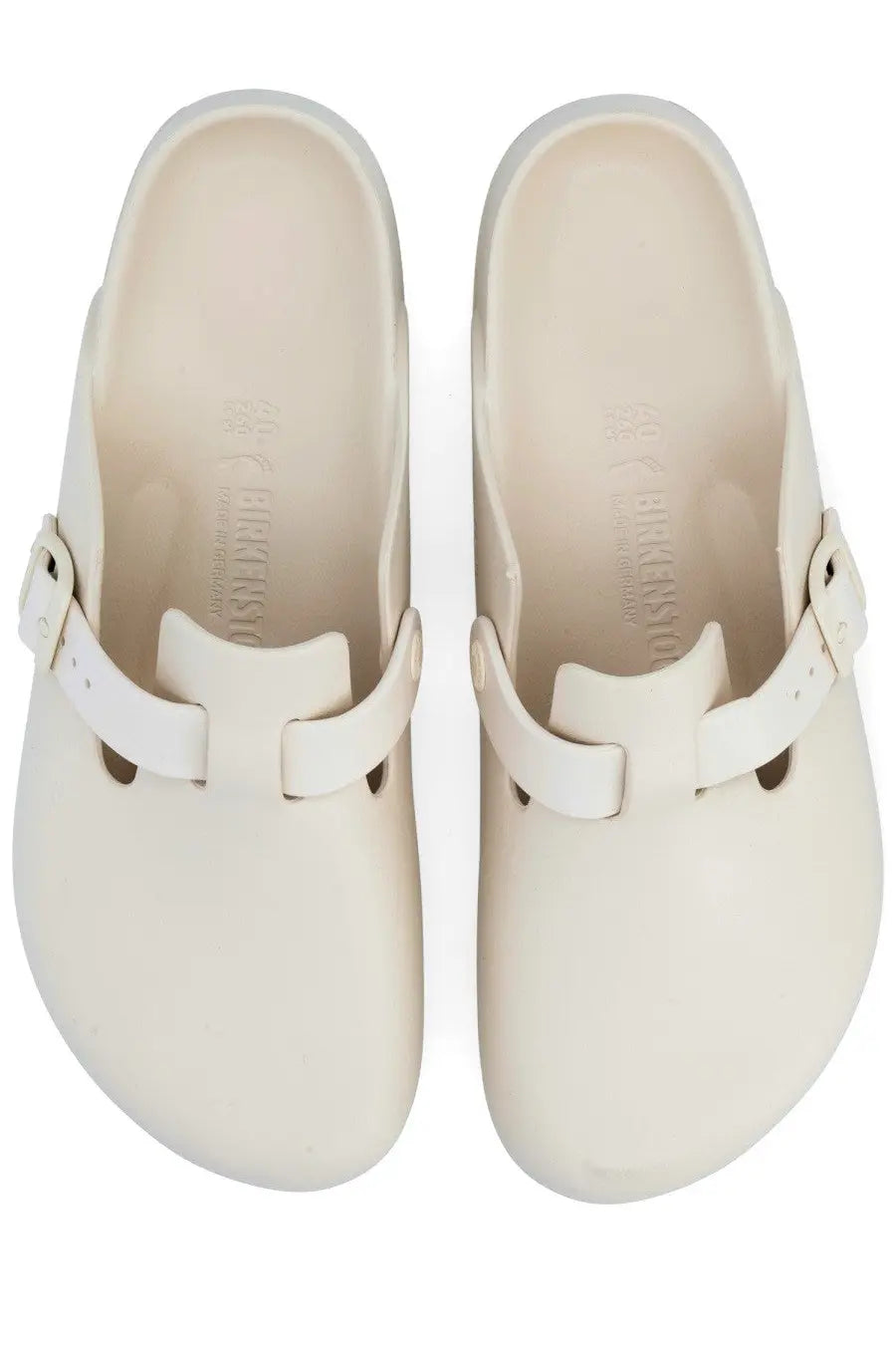 Cream-colored birkenstock unisex sabot boston clogs with smooth matte finish and white leather straps