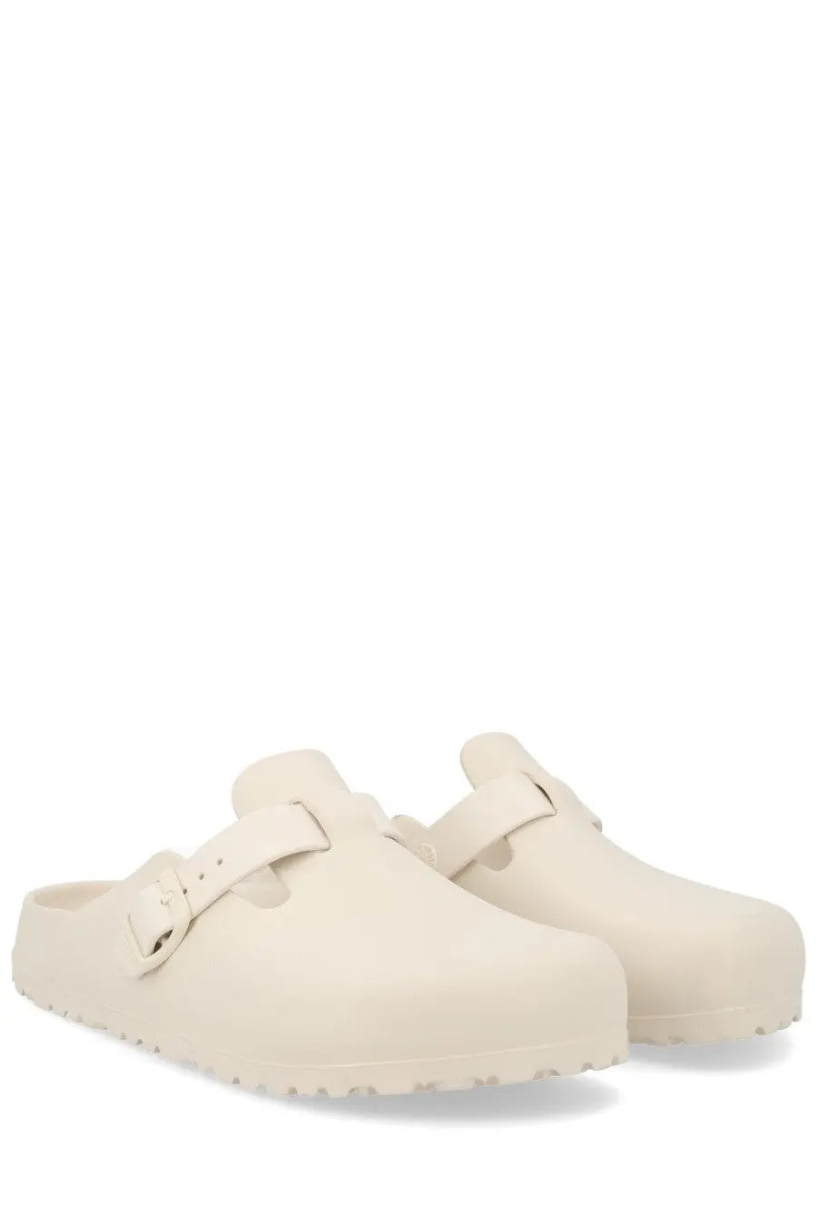 Cream-colored birkenstock unisex sabot boston white clogs with soft smooth leather upper and classic buckle strap design