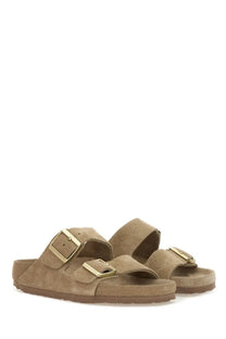 Tan suede birkenstock arizona beige unisex sandal with gold-tone buckle straps and two adjustable bands