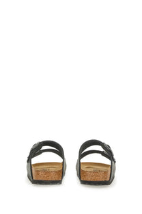 Birkenstock unisex sandal arizona black with classic cork footbed and adjustable black straps shown from the back side