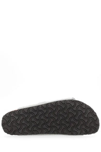 Black rubber sole with a distinctive wavy interlocking pattern on birkenstock unisex sandal arizona grey