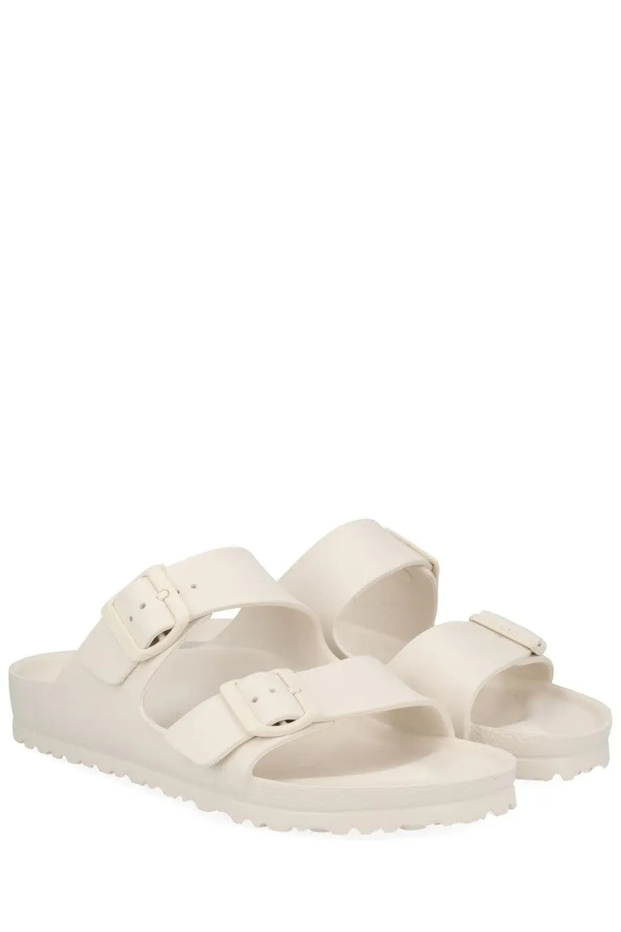 Cream-colored birkenstock unisex arizona sandals with two adjustable straps and metallic buckles in white
