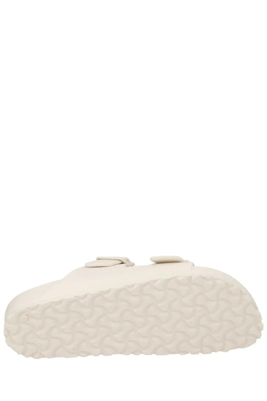 Cream-colored birkenstock unisex sandal arizona with two adjustable straps and textured rubber sole