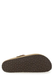 Birkenstock unisex sandal boston brown brown leather clog with textured rubber sole shown from the back side