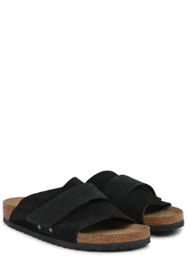 Birkenstock unisex sandal Kyoto black with black suede straps cork footbed and rubber sole shown from the back side