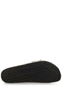 Black rubber sole with distinctive wavy tread pattern on the back of birkenstock unisex sandal madrid big buckle pink