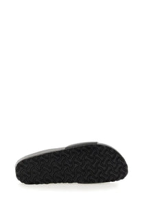 Black rubber sole with wavy interlocking pattern on the back of birkenstock unisex sandal madrid black