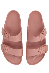 Pair of pink birkenstock unisex sandalo arizona sandals with two adjustable straps and buckle closures