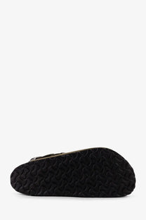 Black rubber sole with wavy textured pattern on birkenstock unisex tokyo suede low sandals green back side