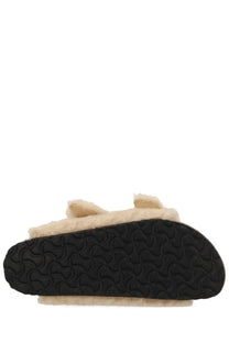 Birkenstock women’s arizona big buckle sandal beige with cream sheepskin lining and black wavy tread sole