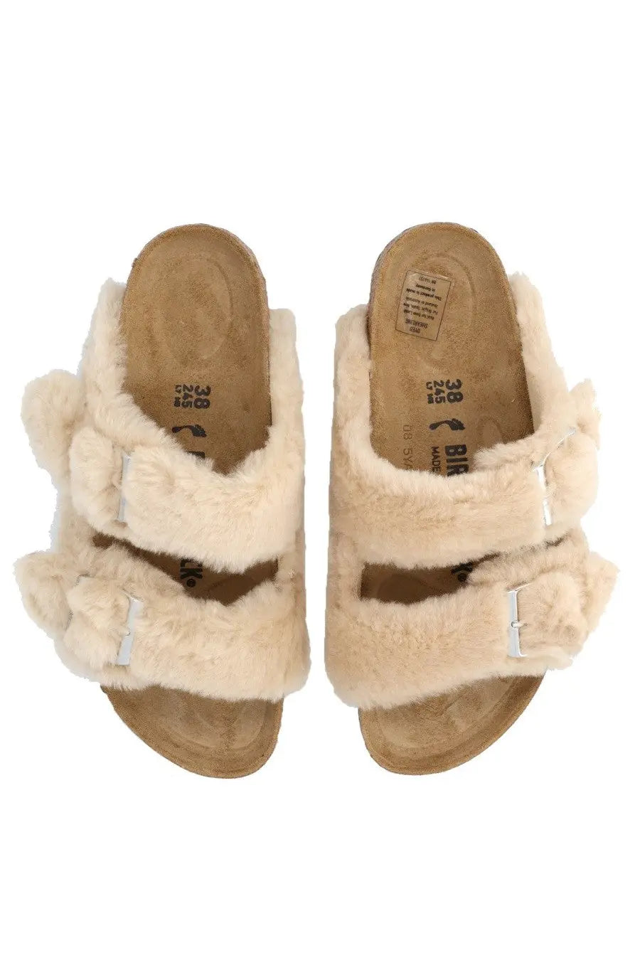 Birkenstock women’s Arizona big buckle sandal beige with cream-colored fluffy sheepskin lining and two adjustable silver buckles