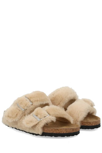 Beige birkenstock women’s arizona big buckle sandal with faux fur lining silver buckle straps and cork footbed