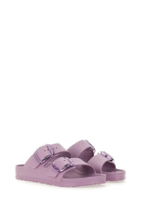 Lilac Birkenstock women’s Arizona big buckle sandal with two metallic buckle straps and a rubber sole