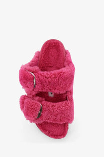 Birkenstock women’s arizona slide sandals in fuchsia fuzzy shearling with two silver buckle straps pink