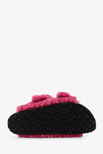 Pink birkenstock women’s arizona big buckle teddy slip-on mule with pink shearling and black rubber sole with logo tread