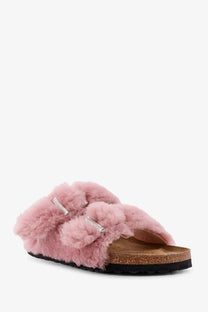 Birkenstock women’s arizona pink fluffy shearling sandals with silver buckle straps and cork footbed