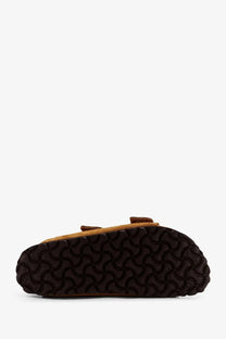 Birkenstock women’s arizona rivet brown suede sandal with textured rubber sole visible from the back side