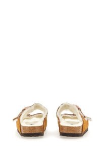 Birkenstock women’s Arizona sandal in mustard-yellow suede with cork footbed and white interior lining