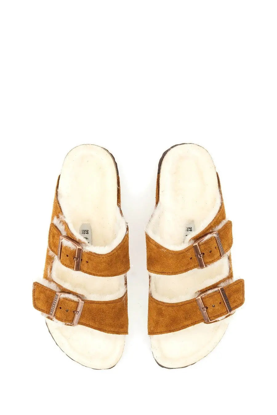 Birkenstock women’s arizona sandal in tan suede with three adjustable straps and plush white shearling lining