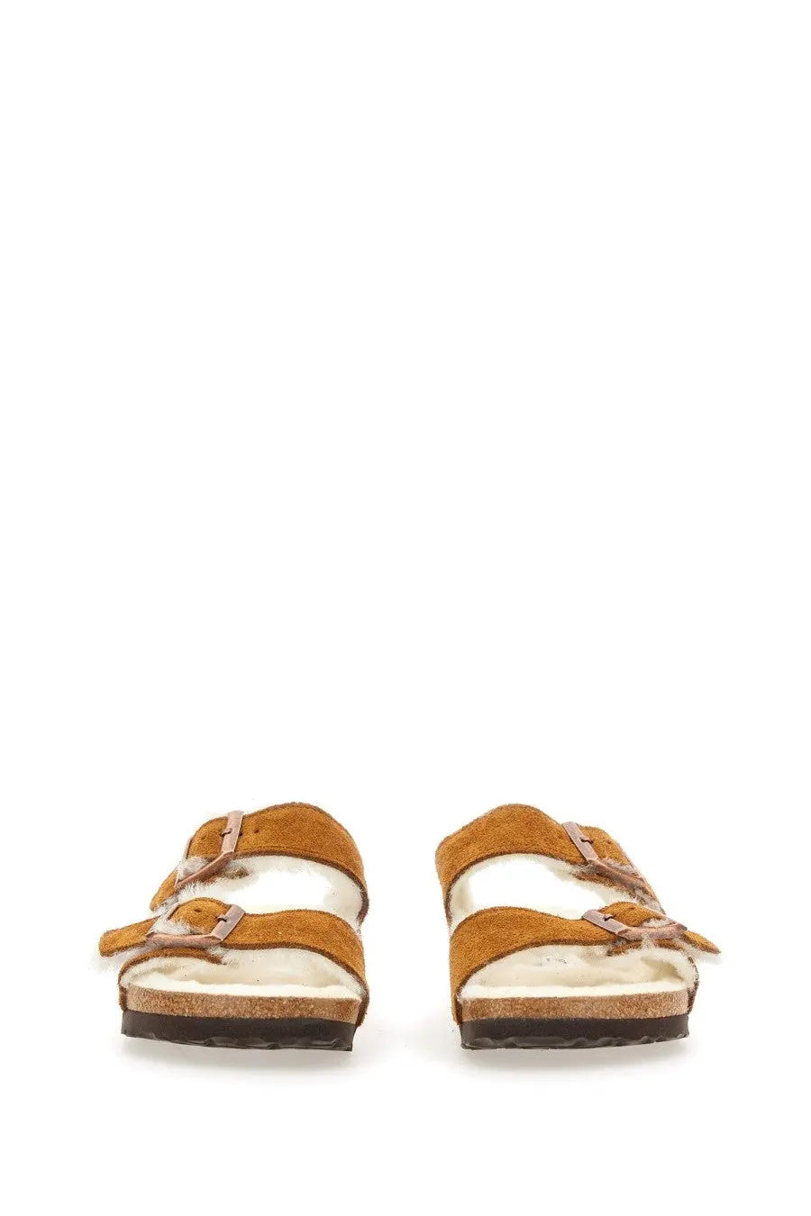 Birkenstock women’s Arizona sandal in tan suede with two adjustable straps and soft white sheepskin lining