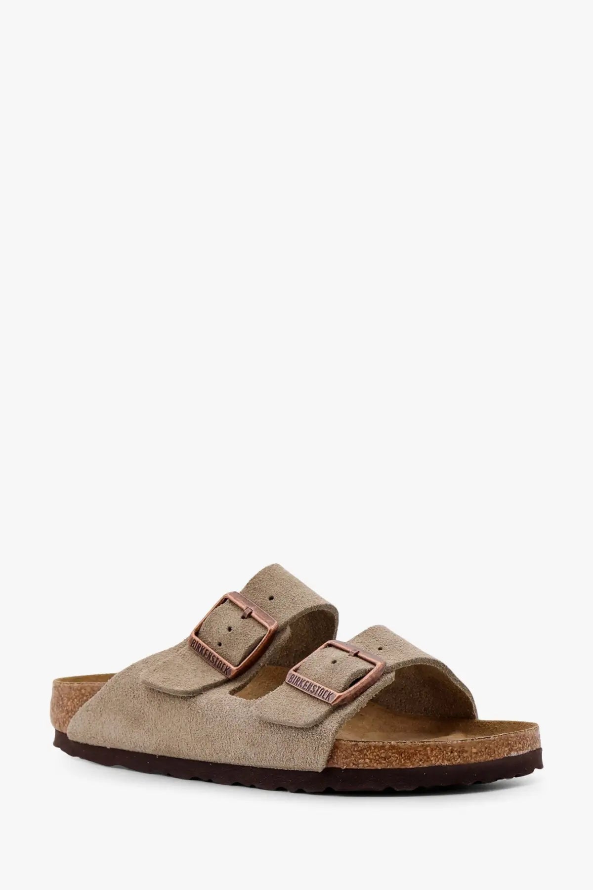 Beige suede birkenstock women’s arizona sandals with rose gold-tone double buckle straps and cork footbed
