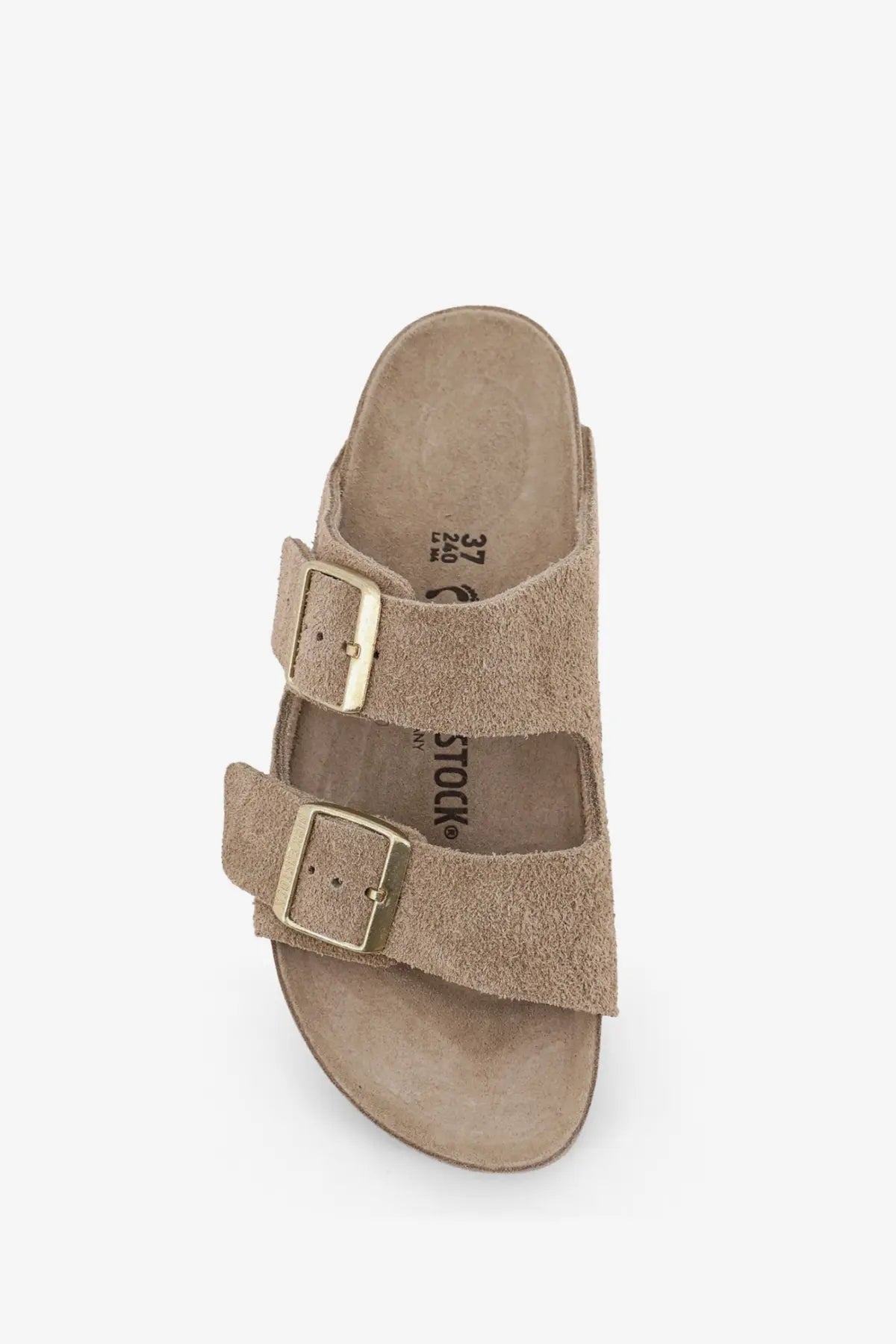 Tan suede birkenstock women’s arizona sandal with two gold-toned buckle straps in beige color