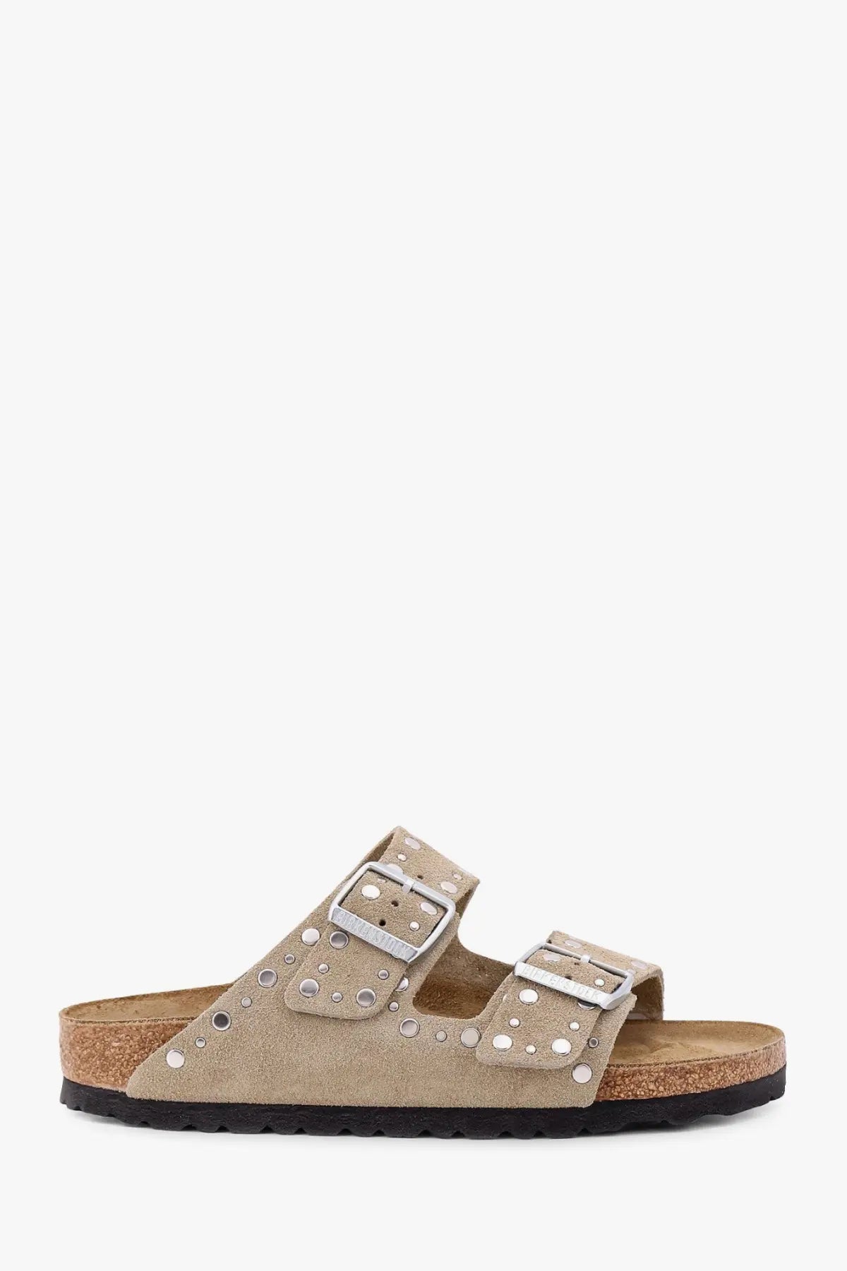 Beige suede Birkenstock women’s Arizona sandals with silver buckle straps and decorative studs in brown