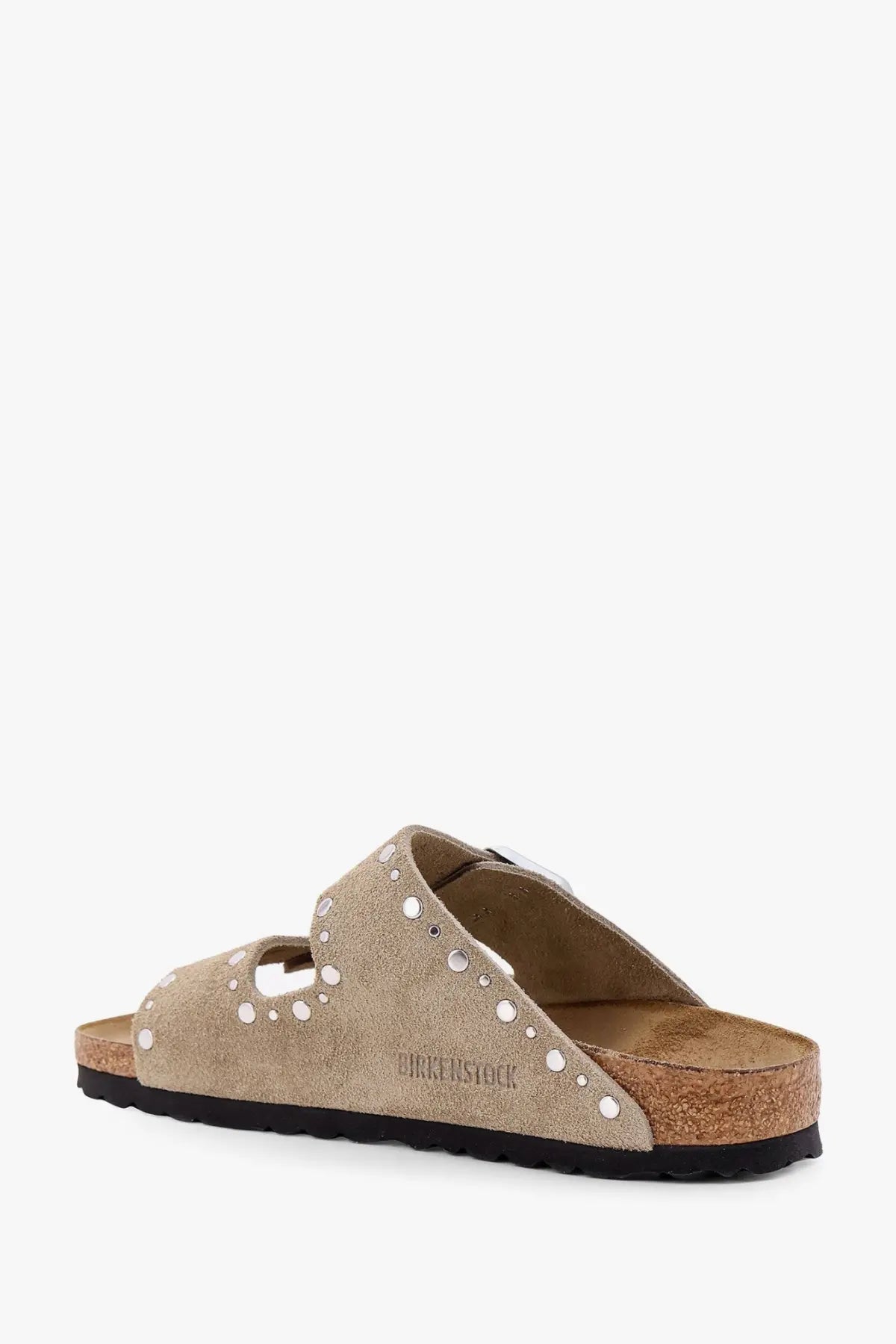 Beige suede birkenstock women’s arizona sandals with silver-toned studs along the straps in brown