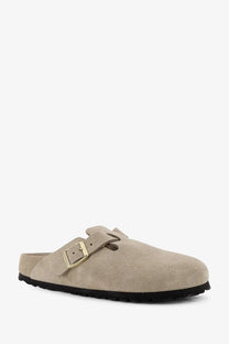 Beige suede birkenstock women’s boston clog with gold-tone buckle and black rubber sole front view