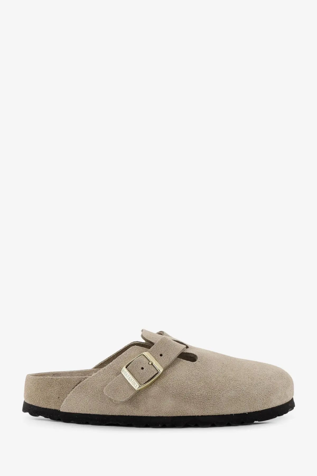 Beige suede birkenstock women’s Boston clog sandal with gold-tone buckle and black rubber sole shown from the back side