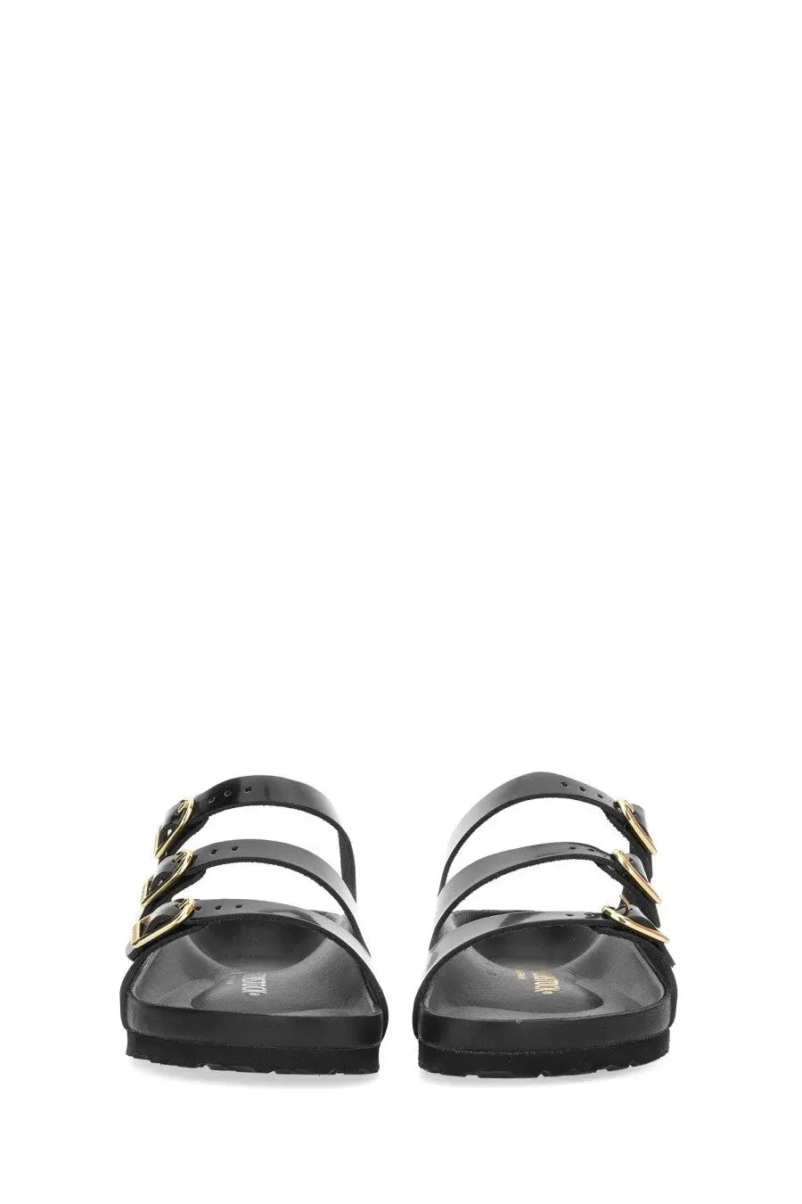 Birkenstock women’s sandal florida in black leather with gold-tone buckle straps shown from the back side