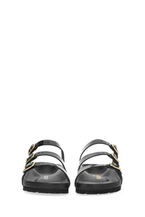 Birkenstock women’s sandal florida in black leather with gold-tone buckle straps shown from the back side