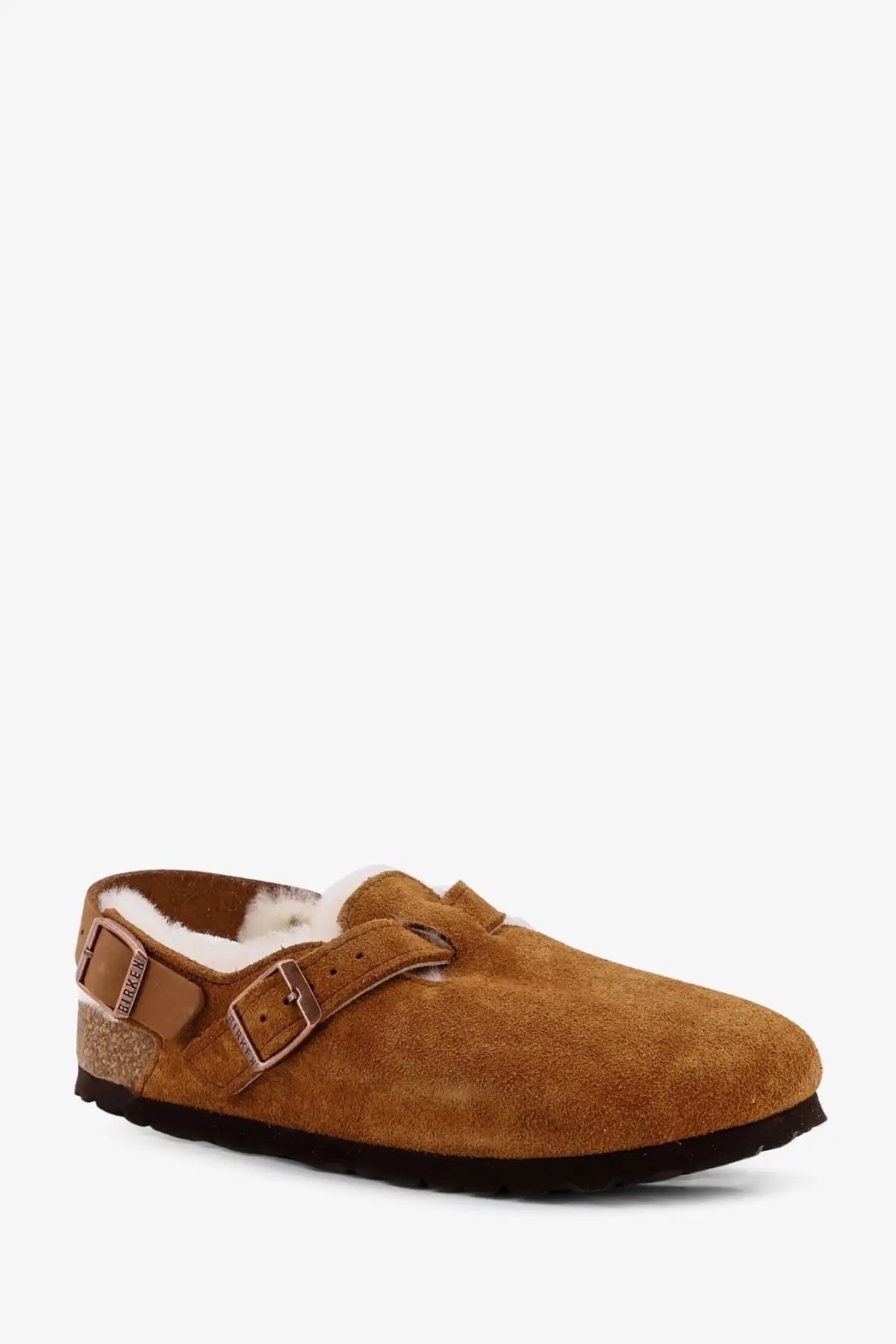 Birkenstock women’s tokio inside shearling mule in tan suede with plush white lining and two adjustable buckle straps