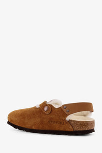 Birkenstock women’s tokio inside shearling suede mule in tan with soft white lining and cork footbed shown from back