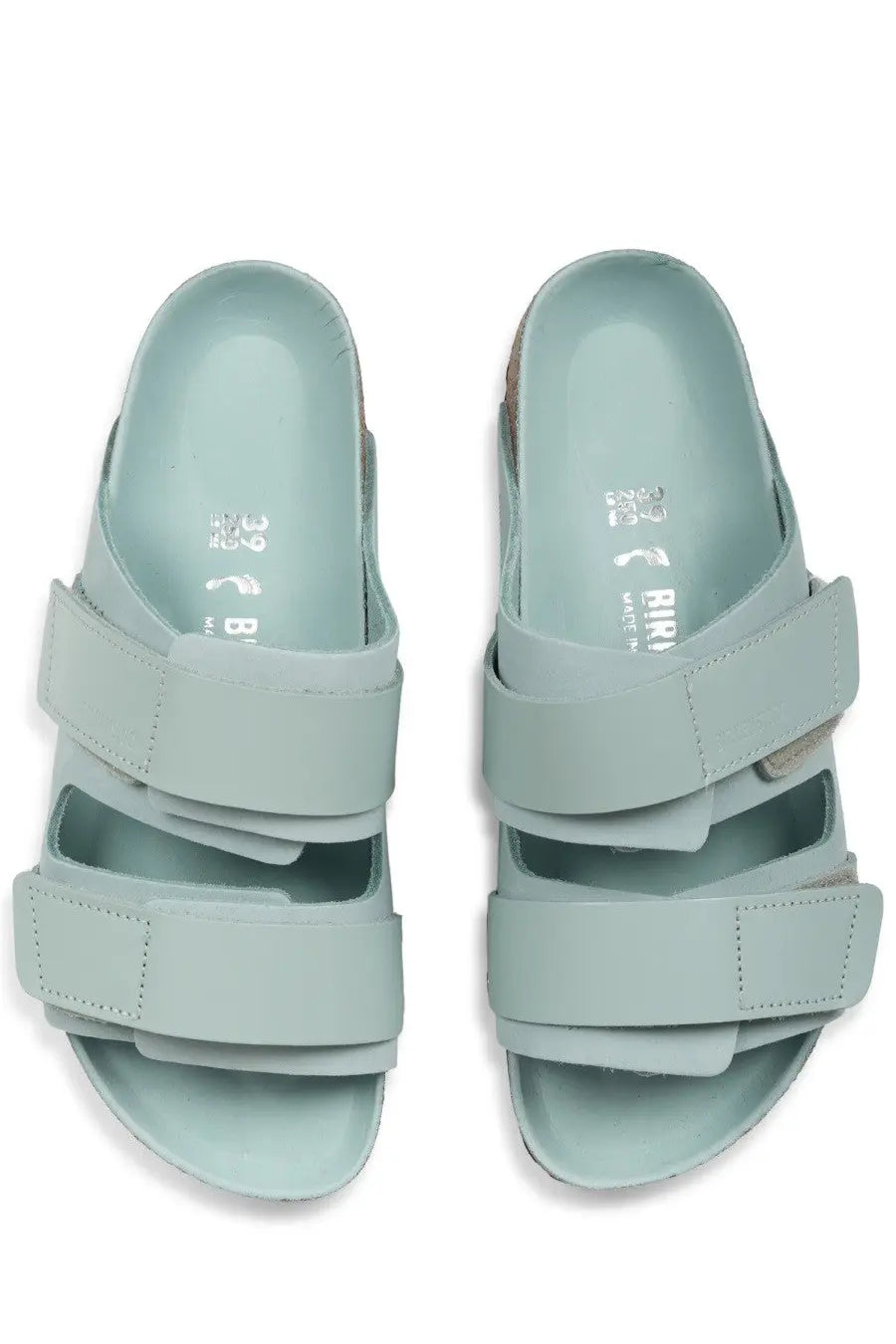Birkenstock women’s uji sandal green with light blue suede-like straps and cork footbed featuring birkenstock logo
