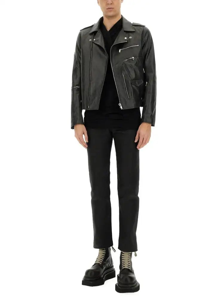 Black leather biker jacket with silver zippers and snap buttons.