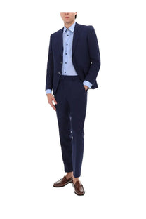 Navy blue tailored BOSS men’s two-piece suit with micromotif and matching trousers worn with light blue shirt