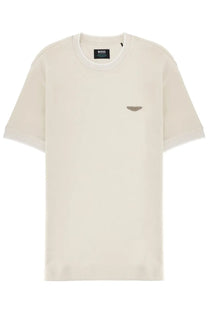 Cream-colored BOSS men’s Aston Martin t-shirt featuring a subtle metallic wing logo on the left chest