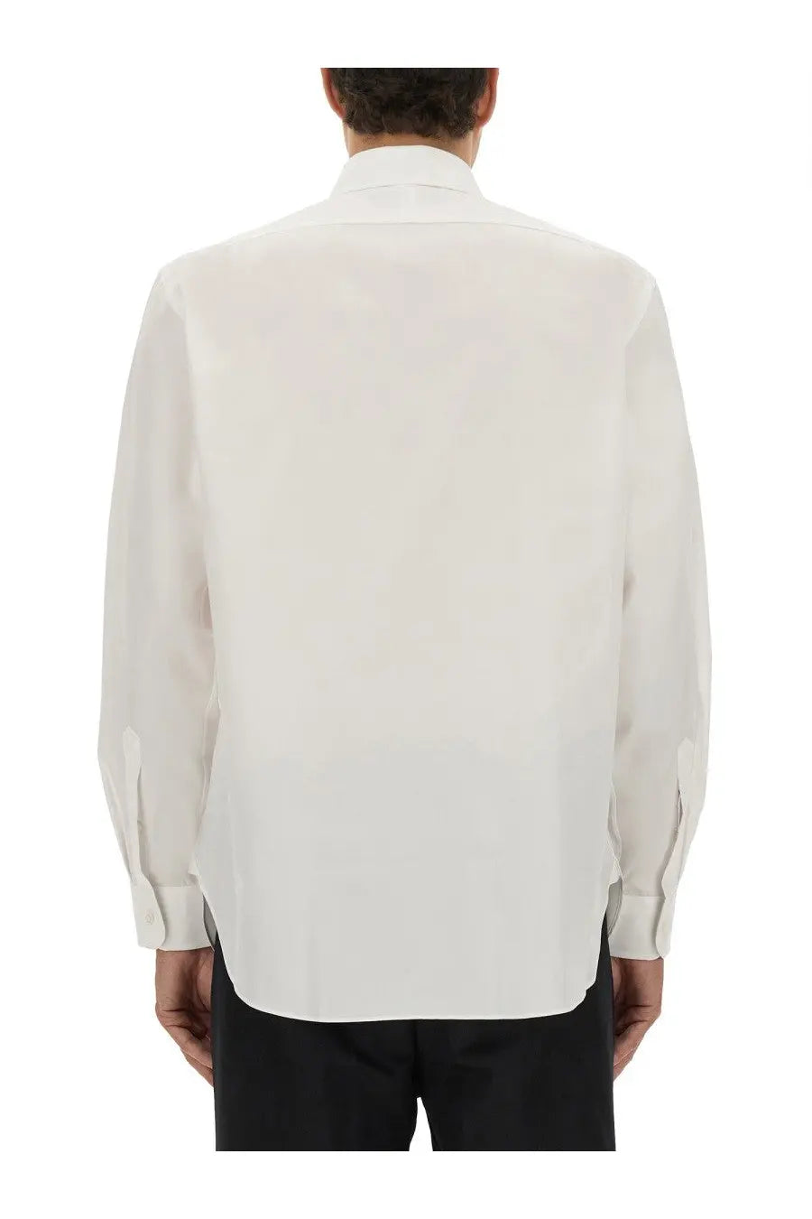 A crisp white BOSS men’s Beckham dress shirt with long sleeves classic collar and neatly folded cuffs