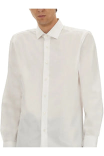 A crisp white long-sleeved men’s dress shirt with classic collar and button-down front from boss beckham collection